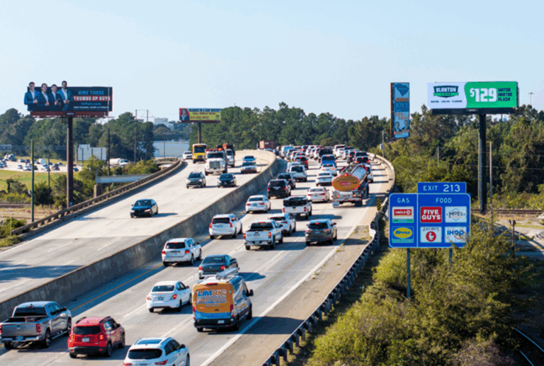 drivers in heavy traffic viewing outdoor signs shows billboard advertising effectiveness