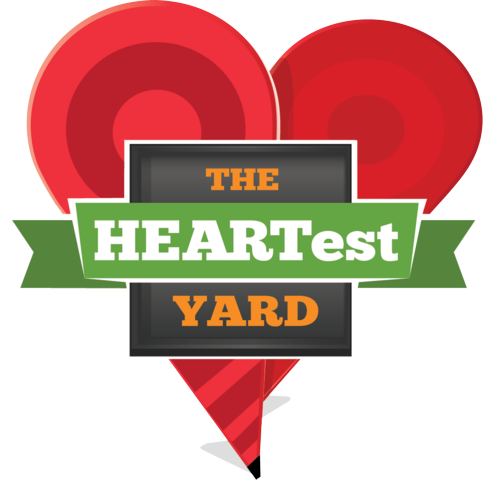 Logo with two red heart shapes behind a rectangular sign reading “THE HEARTest YARD” in orange, white, and green text.