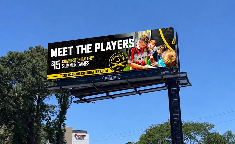 Adams Outdoor digital billboard in Charleston showing Charleston Battery players signing autographs for young fans